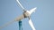 Wind rotated propeller on blue sky, technology,