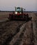 Wind rowing potatoes at night during an Idaho potato harvest.