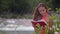 Wind Shakes Girl Hair Reading Book on River Bank