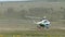 Wind shot Special force soldiers exit from a helicopter at battlefield