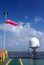 Wind sock on a pole on board a construction work barge at oil field