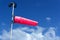 Wind sock on a pole on board a construction work barge at oil field