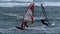 Wind surfers at stormy sea