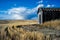 Wind swept Alberta prairies and abandoned buildings