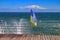 The wind-torn Ukrainian flag against the backdrop of a turbulent sea