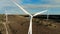 Wind towers working on a farm field. Wind generator, wind turbine from above.