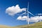 Wind turbine with 3 blades in a field of grass