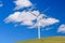 Wind turbine with 3 blades in a field of grass