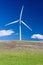 Wind turbine with 3 blades in a field of grass