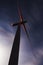 Wind turbine against starry skies