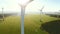 Wind turbine and agricultural fields on a summer day