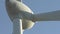 Wind turbine and agricultural fields on a summer day