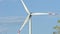 Wind turbine and agricultural fields on a summer day