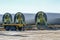 Wind turbine blades are stored near the construction site, heavy industry in preparation for a renewable energy power plant, copy