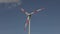 Wind turbine close-up against the background of clouds floating in the sky. Rotation of large wind turbine blades close