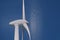Wind turbine close-up with huge blades generates environmentally