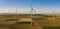 Wind turbine with coal power plant view from drone - environment friendly, renewable energy concept - copyspace for your