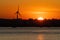 Wind Turbine dominating the skyline at sunset in Slade Green near dartford along the Thames Estuary, Kent England