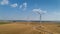 Wind turbine farm over the blue sky
