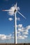 Wind turbine farm over the clouded sky