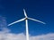 Wind turbine front view on blue sky