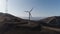 Wind turbine generating electricity on blue sky