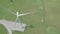 Wind turbine on green field aerial view. Wind power turbine generation on energy station drone view from above