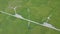 Wind turbine on green field drone view from above. Alternative natural source and ecology conservation. Wind farm aerial