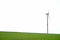 Wind turbine in a green field, space for text. Beautiful spring greenery