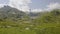 Wind Turbine high in the mountains next to hydroelectric plant. Windmill and scenic landscape. The Gotthard Pass, Canton Ticino,