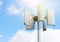 Wind turbine and lamp against the sky, alternative energy, toned