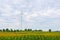 Wind turbine made Renewable Energy on field, blue sky and cloud background at Chaiyaphum Thailand