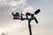 Wind turbine made by wood on nature white cloud and blue sky.