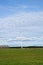 Wind turbine in the middle of a field in Latvia, near Ventspils. Green electricity production concept