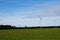 Wind turbine in the middle of a field in Latvia, near Ventspils. Green electricity production concept