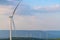 Wind turbine renewable energy source summer in forest mountains landscape energy transmission distribution equipment in natural