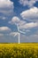 Wind Turbine under a blue, cloud-strewn sky