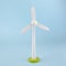 Wind turbine wooden toy or light blue background, eco concept