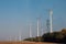 Wind turbines against blue sky