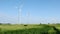 Wind turbines against bright blue sky