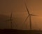 Wind turbines in blowing dust at sunset near Palm Springs CA