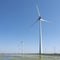 Wind turbines and blue sky in the north of dutch province groningen near eemshaven