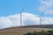 Wind turbines with clouds in the background