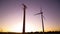 Wind turbines in the countryside under a beautiful sunset