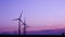Wind turbines in the countryside under a beautiful sunset