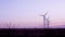 Wind turbines in the countryside under a beautiful sunset