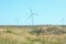 Wind turbines energy converters on the nature background