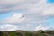 Wind turbines farm on coast hills