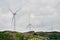 Wind turbines farm on coast hills