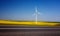 Wind turbines. Fields with windmills. Rapeseed